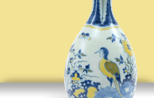 Delftware Vase On Yellow Background