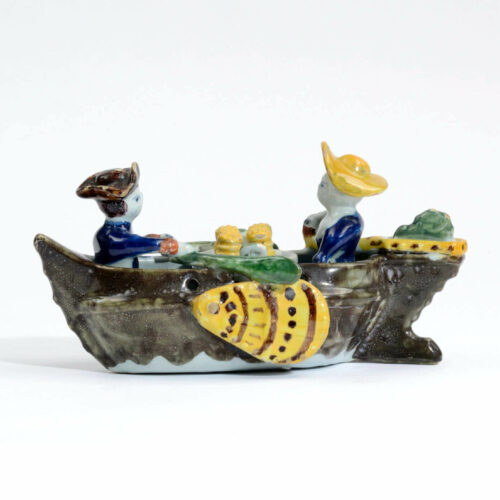 Polychrome Group Of Couple In Boat