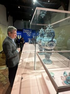 Robert looking at two vases sold by his grandfather in 1967